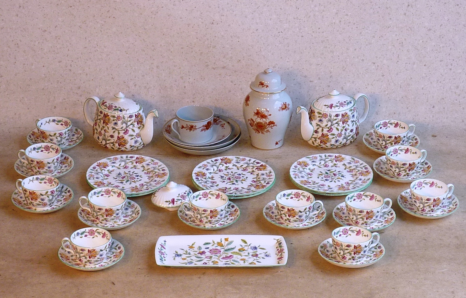 A Minton bone china Tea Service decorated in the Haddon Hall pattern (B. 1451) and comprising two