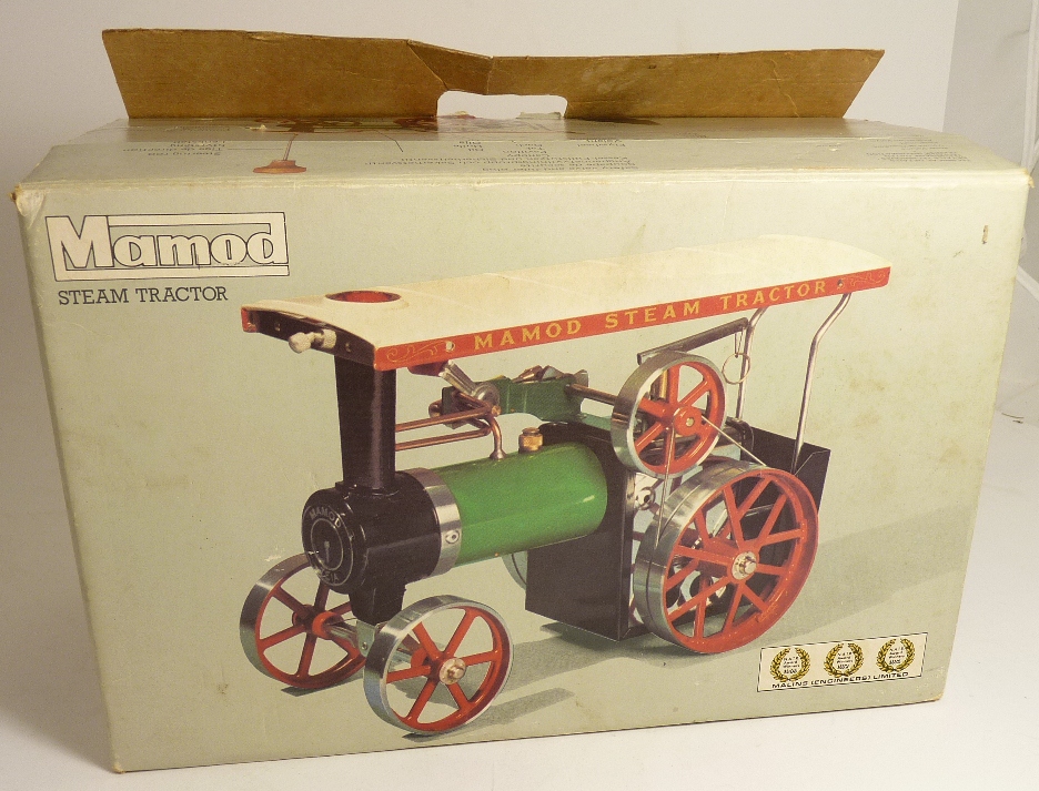 A Mamod Steam Tractor in box with steering rod and funnel ++near mint, still packaged in box