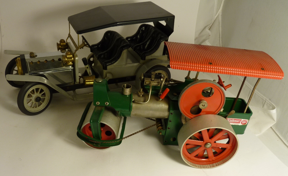 An unboxed Mamod Steam Roadster together with a Wilesco "old Smokey" steam road roller, unboxed (