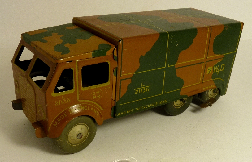 A Mettoy tinplate clockwork army lorry with camouflage finish, printed detail, opening back door,