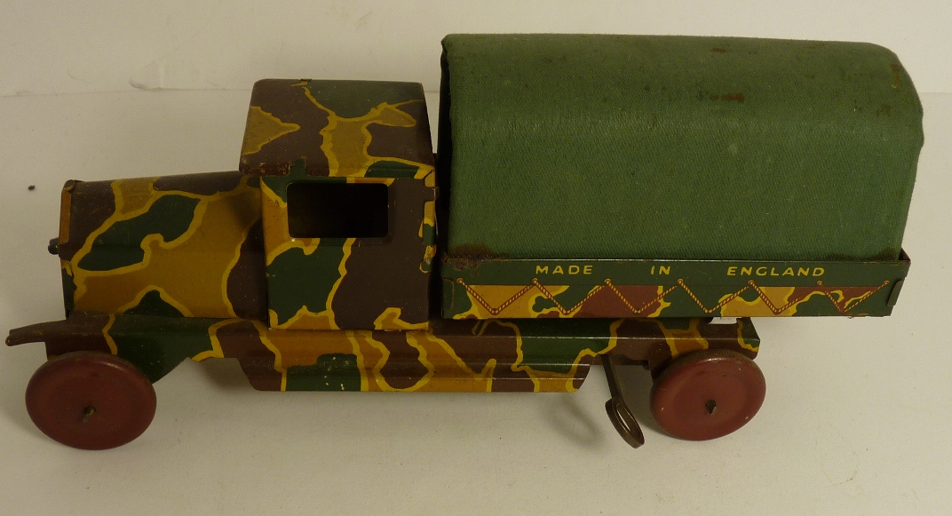 An English made tinplate clockwork Army Wagon, printed camouflage finish with rope detail and canvas