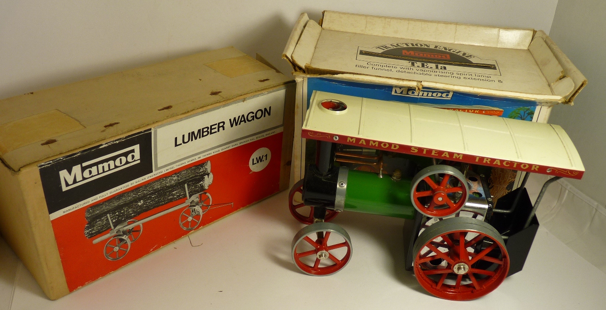 Mamod Steam Tractor in box with steering rod together with a boxed Lumber Wagon ++models very good/