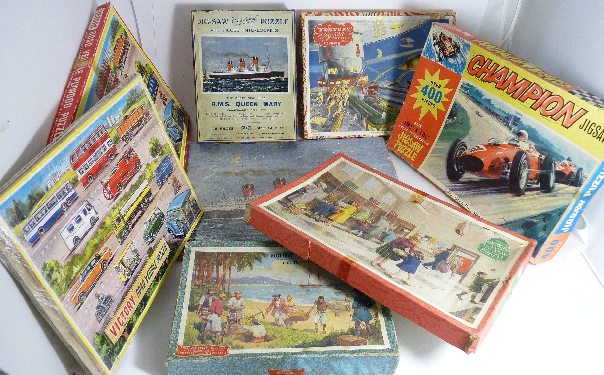 An "Academy" jig saw puzzle of RMS Queen Mary, in box (complete) together with a Victory Road