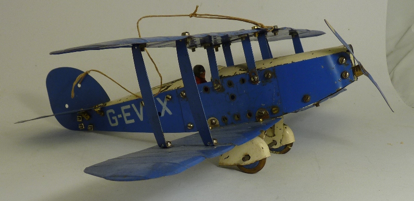 A Meccano constructed plane made as a blue and white single engine bi-plane G-E VTX, with red