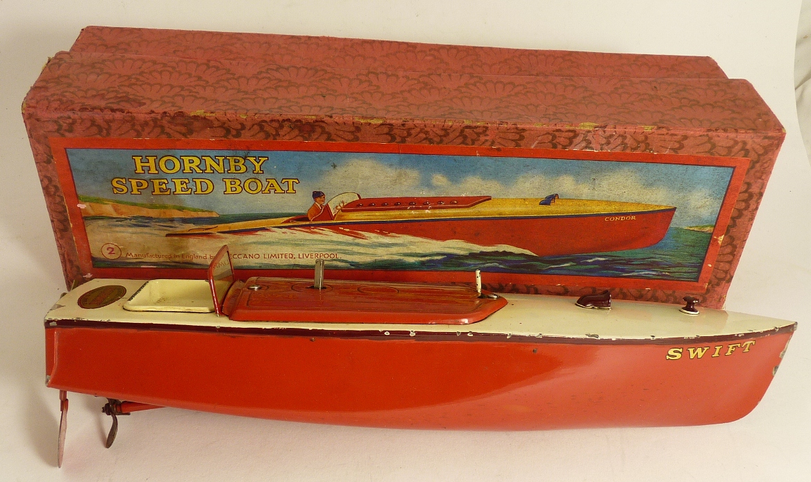 A Hornby no.2 clockwork metal Speed Boat "Swift", red/cream, in original box and with key (