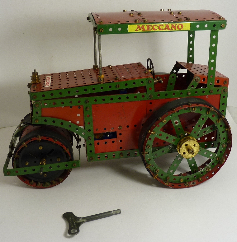 A Meccano clockwork display model of a road roller, green and red, with key, 27cms high ++