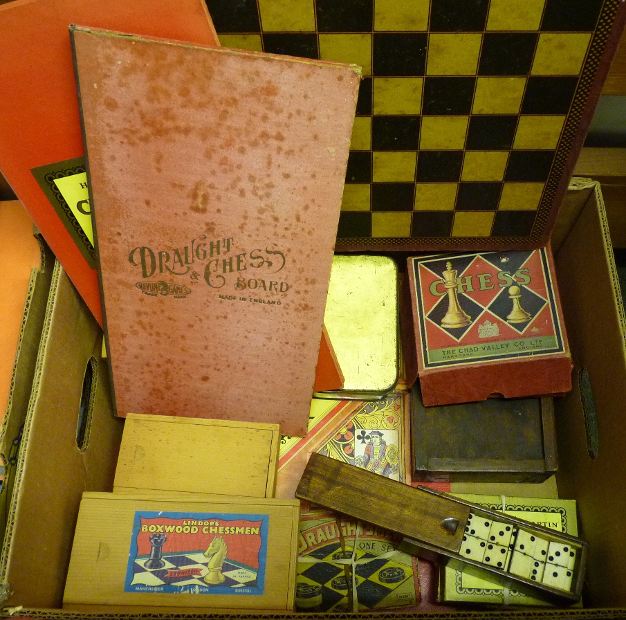 A quantity of boxed chessmen, draughts and dominoes, includes Chad Valley plastic chess set; old