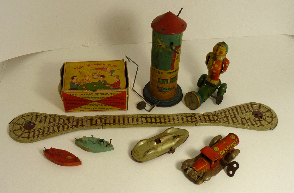 A small "Gasoline" tinplate clockwork tanker lorry; a Japanese tinplate clockwork clown toy