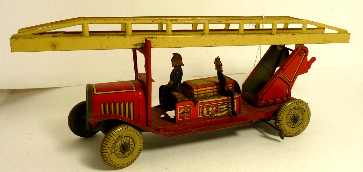 An early 20th Century tinplate clockwork Fire Engine with extending turntable ladder, two firemen