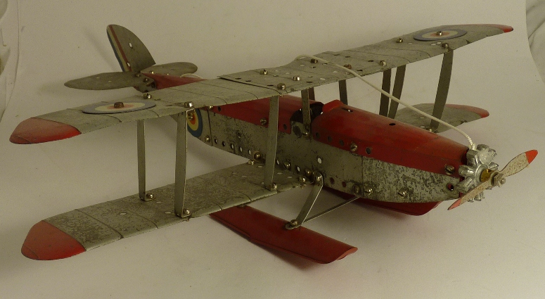 A Meccano constructed single engine biplane seaplane, red and silver with RAF roundels and red