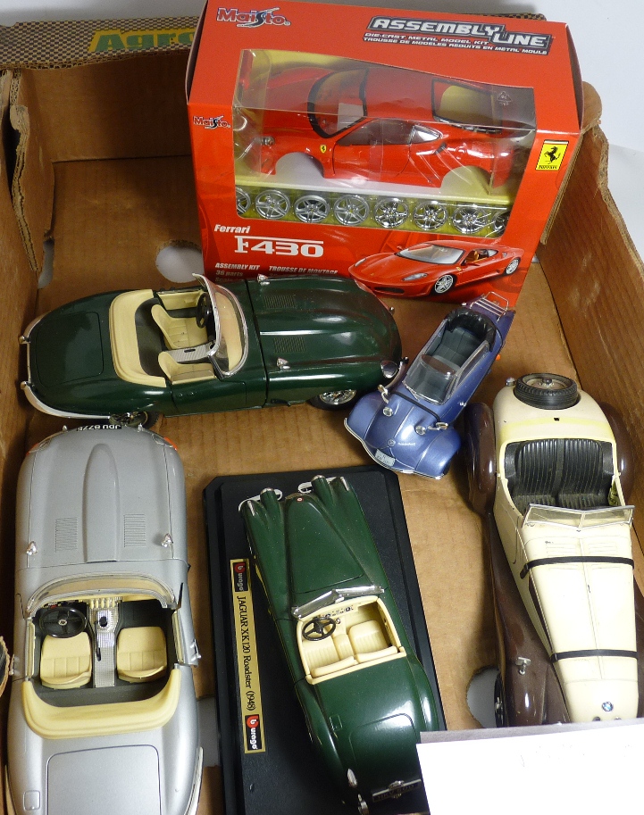 A Maisto Ferrari construciton kit in box together with some larger scale model cars