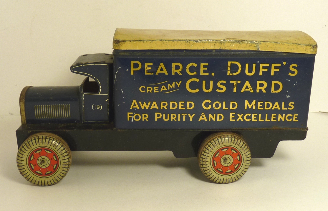 A tinplate lorry biscuit tin for Pearce Duff`s Creamy Custard.... deep blue with yellow lift off