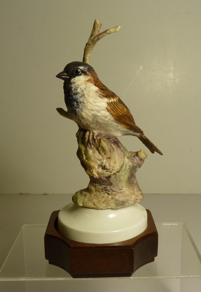 An Albany Fine Art limited edition porcelain figure of a Sparrow perched on a branch by David