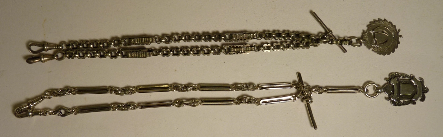 A fancy link silver Albert with attached silver medallion together with another silver fancy link