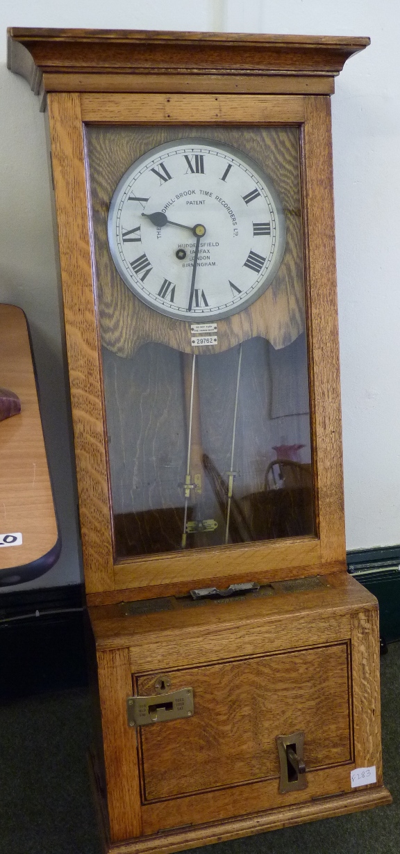 A Time Recorder clock in oak case, the silvered metal dial inscribed "The Gledhill-Brook Time