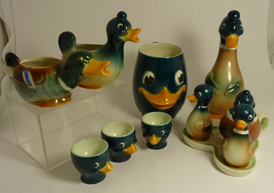 Goebel duck character mug; three piece duck cruet on stand and other duck items; egg cups; two small