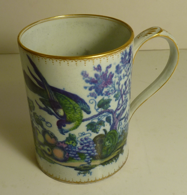 A 19th Century cider mug, pint size, with transfer decoration of a parrot and butterfly with