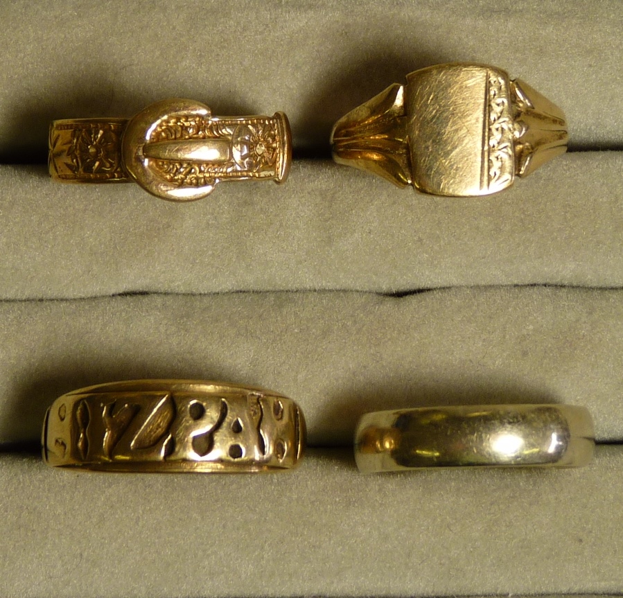 A Gent`s 9ct gold Mizpah ring; a 9ct gold buckle ring ; 9ct gold signet ring and a 9ct gold