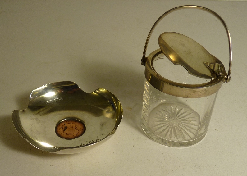 A small silver dish with copper penny set into the base together with a cut glass preserve pot