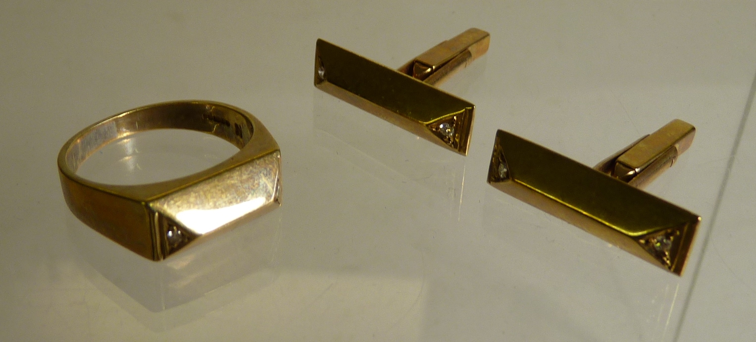 A pair of 9ct gold cufflinks set with small diamonds together with a matching Gent`s ring (3) 11g