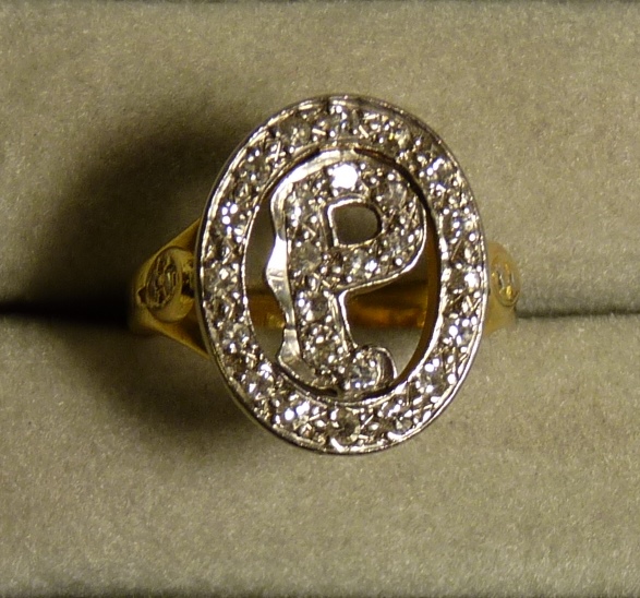 A modern gold "initial" ring, the letter "P" set with diamonds within a diamond border, unmarked but