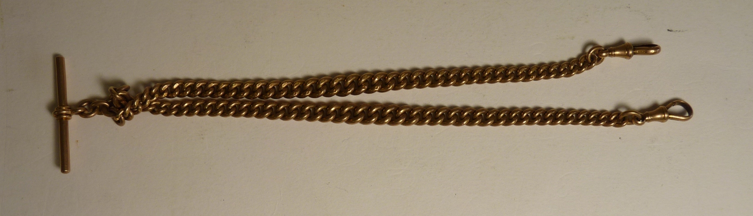 A 9ct gold curb link Albert with "T" piece and clips, 39cms long, 54.7g