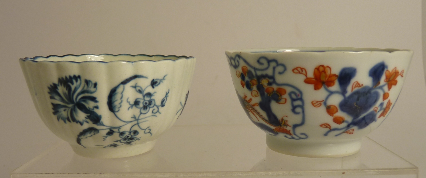 An 18th Century Worcester blue and white glazed tea bowl with carnation pattern, marked with