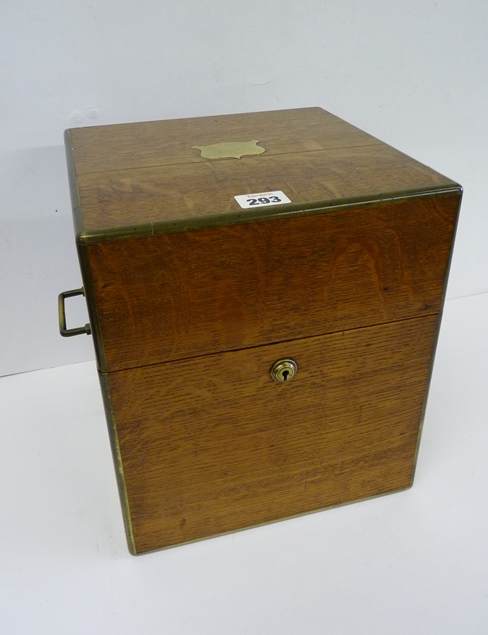 A 19th Century oak decanter box with plain brass escutcheon, inset brass carrying handles and