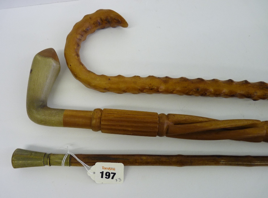 A late 19th/early 20th Century novelty walking cane, the knotted stick with bone and horn pommel