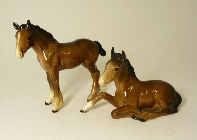 A Beswick bay standing foal and another lying down (2).