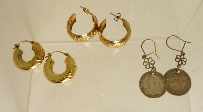 A pair of 9ct gold hoop earrings; another pair of 9ct gold twisted hoop earrings (5.9g approx) and a