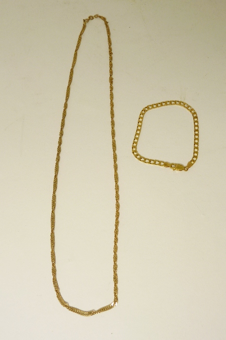 A 9ct gold curb link bracelet and a 9ct gold rope twist neck chain. 11g approx.