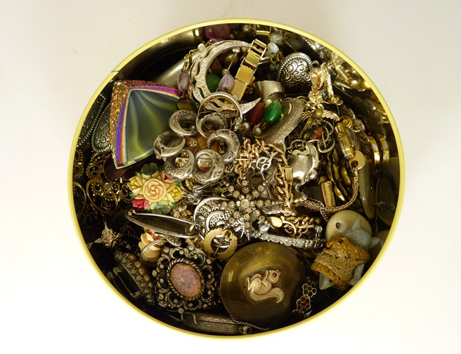 A quantity of costume jewellery including bangles, a powder compact, a horn magnifying glass,