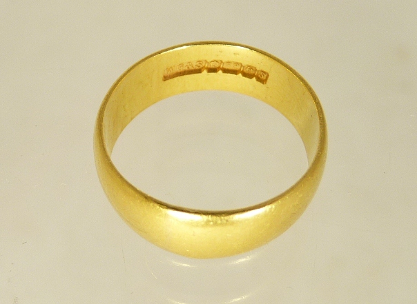 A 22ct gold wedding band size K , 4.2g approx.