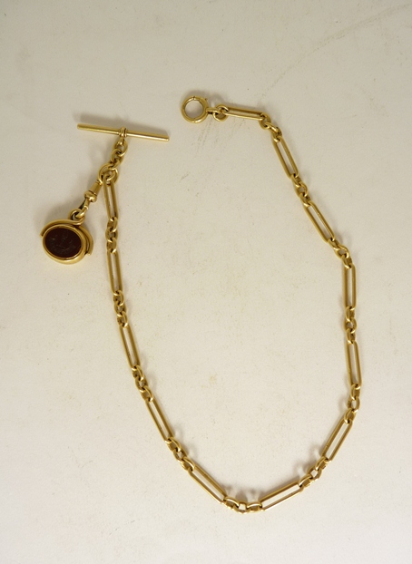 An 18ct gold Albert chain with T bar, jump ring and clip; 41.2g approx and with an attached 18ct