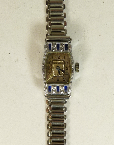 A 1930`s ladies Bulova cocktail watch in a 14ct gold filled case, the case set with paste stones.