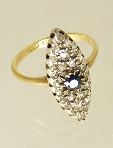 An 18ct gold diamond and sapphire set ring of navette shape, the ring set with a central circular