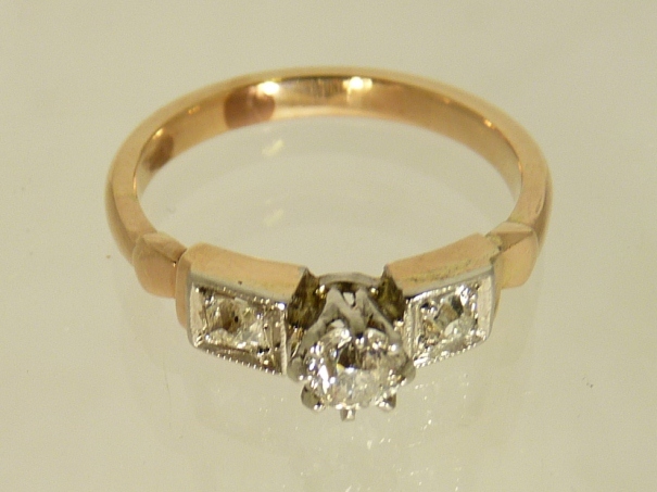 A 14ct gold (tested) diamond ring, the ring set with a central circular brilliant cut diamond 1/4