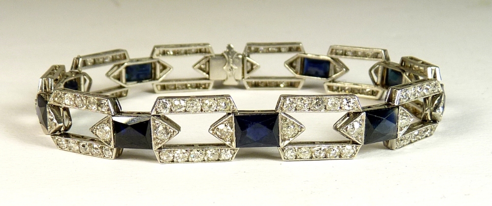 A fine French art deco sapphire and diamond bracelet designed as open rectangular pinned diamond set