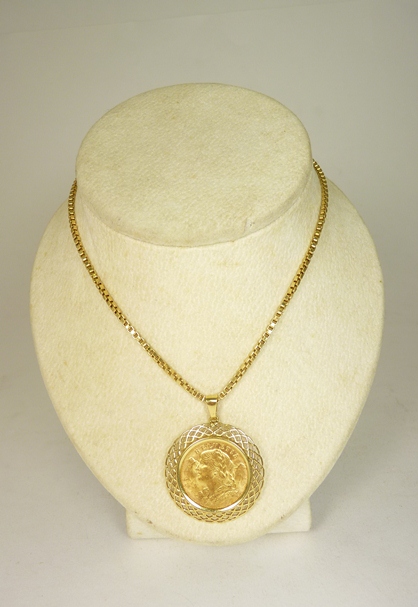 A Swiss gold 20 Franc coin 1910; mounted in a clip 18ct gold pendant mount, the circular mount of