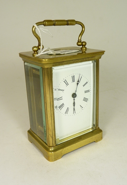 A standard brass cased carriage clock, white enamelled dial with black Roman numerals (dial AF).