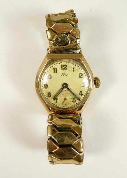 A 9ct gold cased Elco gents wrist watch on an expanding gold plated strap, the matt dial with