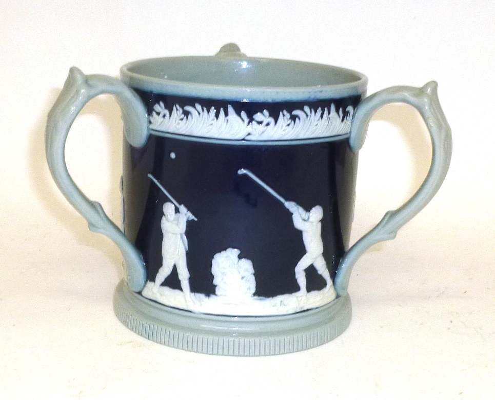 A Late 19th Century Copeland Pottery Relief Moulded Golfing Tyg, decorated with action scenes of