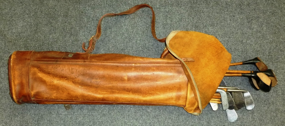 A Vintage Leather Golf Bag, containing twelve hickory shafted golf clubs, including two Lockwood