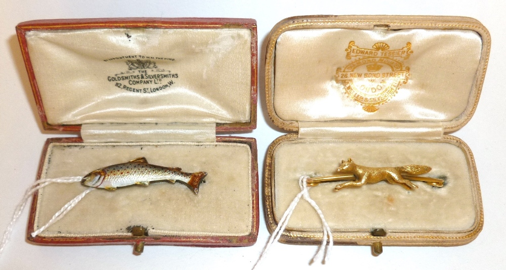 Two Cased Sporting Brooches -  an enamelled silver salmon brooch, in a Goldsmiths and Silversmiths