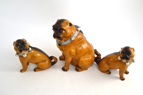 Pair of late 19th/early 20th century Germand pug dogs and a larger example (a.f.)