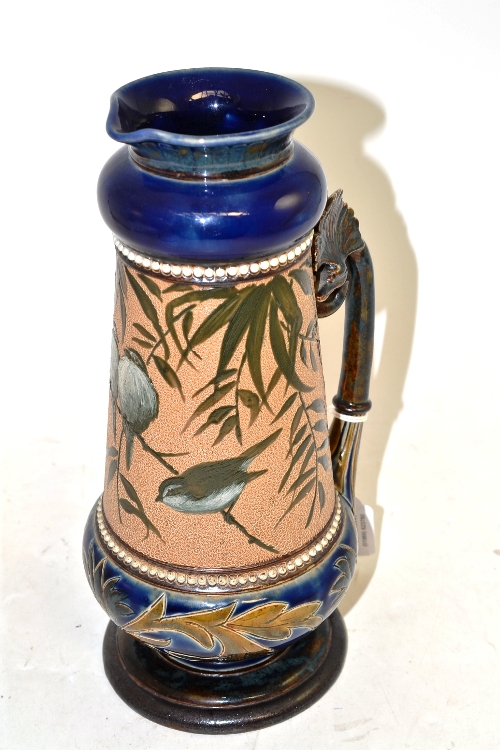 A Doulton Lambeth stoneware jug, by Florence Barlow, pâte-sur-pâte decoration of blue tits 27.5cm (