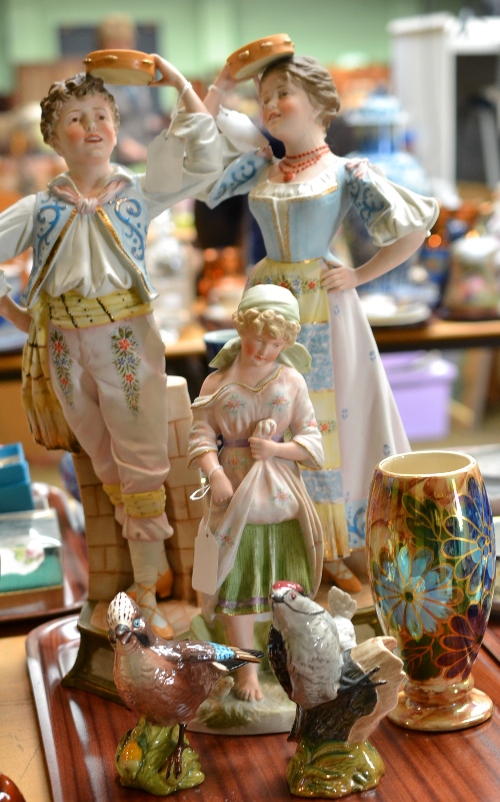 A pair of bisque figures of a boy and girl, another girl with chickens, two Beswick birds and a