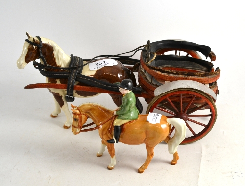 A Beswick child on a pony and a Beswick horse and trap