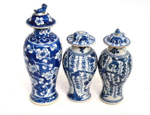 Pair of Chinese blue and white vases and covers (a.f.) and another